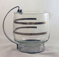 Unknown Creamer with Metal Holder